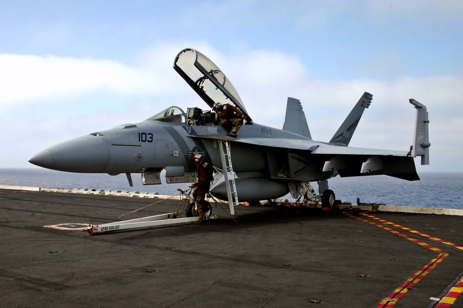 FA18 SuperHornet military jet on board the USS Carl Vinson undergoes maintenance