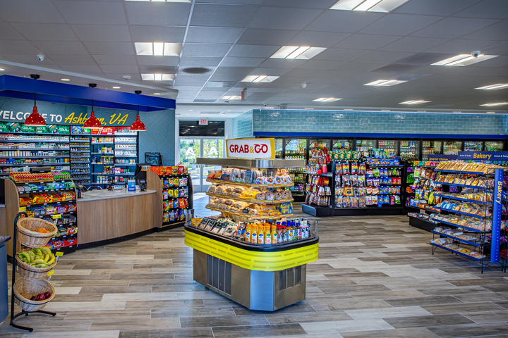 Bright and modern convenience store interior featuring grab-and-go snacks, fully stocked shelves, and a clear floor layout designed to support efficiency with limited staff