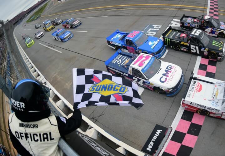 Offical waving Sunoco race flag at racing truck race