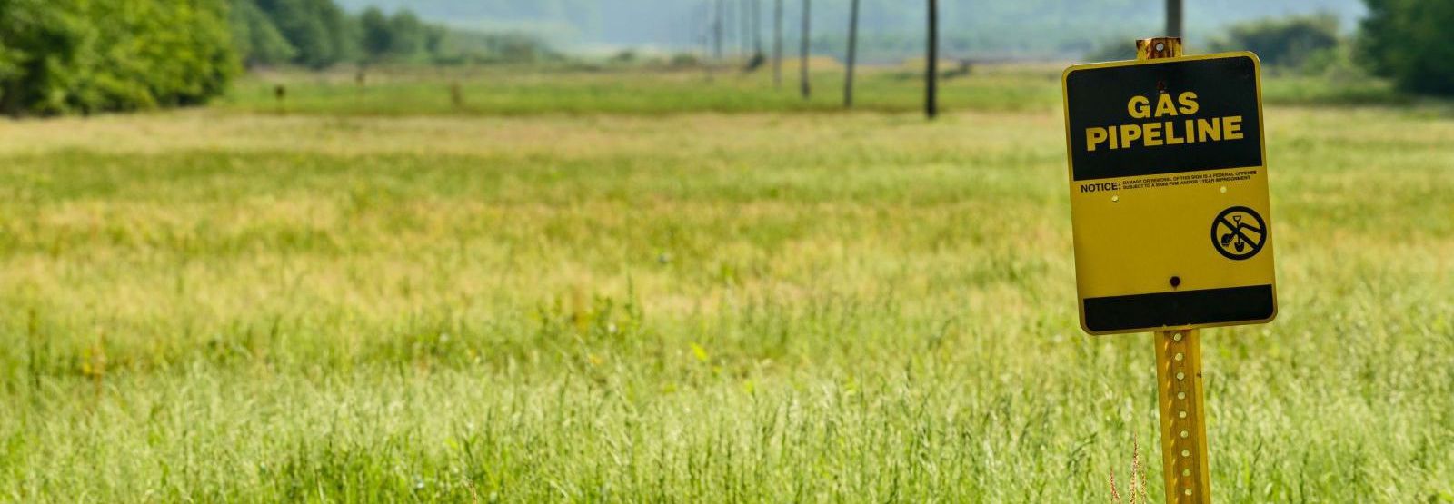 Signage that indicates natural gas pipeline path.